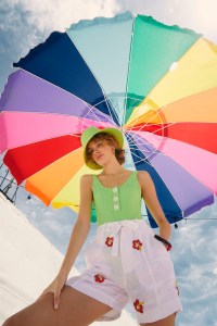 Solid & Striped’s polyamide and Lycra maillot and linen beaded shorts. Eric Javits hat; Choked by a Thread earrings; Tuza bracelet.