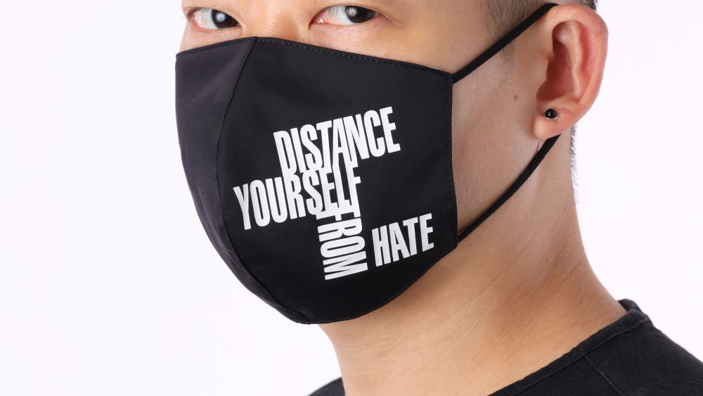 Jason Wu wearing the “Distance Yourself From Hate” mask.