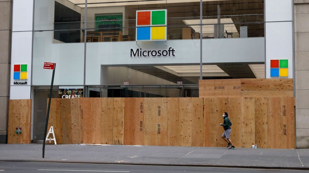 A man jogs past the Microsoft Flagship store boarded up windows on Fifth Avenue after looting riots a night earlier as part of the response by protesters to George Floyd's death, in New York, New York, USA, 02 June 2020. A bystander's video posted online on 25 May, shows George Floyd pleading with arresting officers that he couldn't breathe as an officer knelt on his neck. The unarmed black man soon became unresponsive, and was later pronounced dead. According to reports on 29 May, Derek Chauvin, the police officer at the center of the incident, has been taken into custody and charged with murder in the death of George Floyd.Looting Clean-up New York, USA - 02 Jun 2020