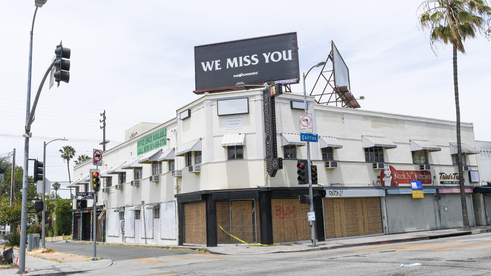 Cleanup efforts by volunteers is seen in Los Angeles following a night of protests over the outrage for the killing of George Floyd on June 1.