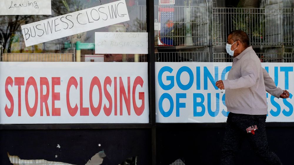 store closing signs man walking