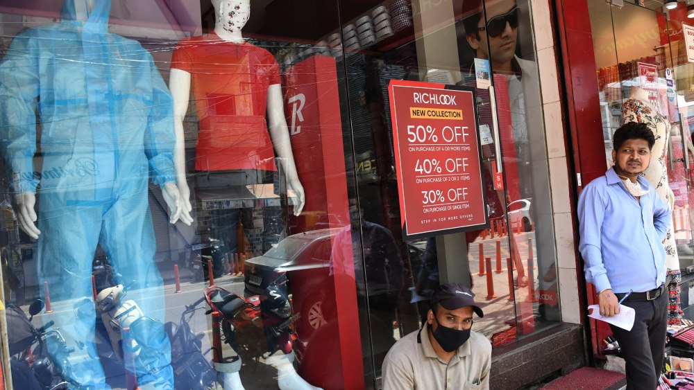 Indian shopkeepers wait for the custumers in New Delhi, India 11 June 2020. Indian government has decided to provide relaxation in the ongoing lockdown but it will continue until 30 June, in 'containment zones.' The restrictions will be eased in a phased manner with places of worship, hospitality services and shopping malls scheduled to be opened in the initial phase, with restrictions. The areas termed as 'containment zones' will be identified by authorities and those areas will remain under complete lockdown.Coronavirus lockdown in New Delhi, India - 11 Jun 2020