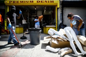 Volunteer community members clean up a looted store in Philadelphia.