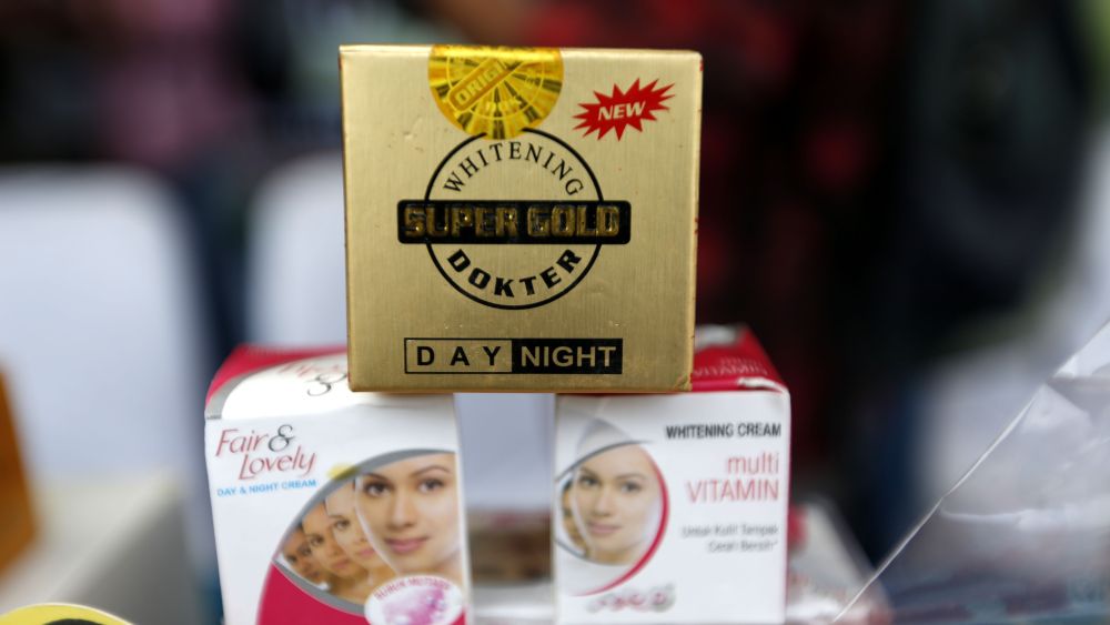 Indonesia National Agency of Drugs and Food Control (BPOM) officers display skin whitening beauty products that are considered as illegal and a danger to human health before they are destroyed, in Banda Aceh, Indonesia, 07 November 2017. Some beauty products are considered hazardous as they contain mercury as ingredients. Indonesia is an illegal goods destination and market, which are procured through international smuggling, especially Chinese products those from other Asian countries. According to a 2009 report published by Global Industry Analysts, the skin lightening industry has an estimated global value of 10 billion US dollar, with a projected value of 23 billion US dollar by 2020. The products are used throughout Africa, the Middle East and Asia, where segments of the population subscribe to the belief that lighter skin connotes wealth, beauty, sophistication and elevated class standing. Due to lax regulation in this field of cosmetic products and treatments, numerous health risks are associated with the use of skin lightening and skin bleaching products. In May 2017, a skin bleaching product available online called Royal Expert Whitening Cream was tested by the Health Services Authority in Singapore and was found to contain high levels of mercury, a heavy metal which can cause mercury poisoning, as well as psychiatric and neurological problems. Despite the risks, the demand for these products is increasingly high throughout Asia, where historical social norms state that dark skin is a signifier of laboring outdoors and thus being a part of a lower economic class. Companies such as Beirsdorf AG, Clarins SA, and Dabur India Limited offer skin creams, pills and injections which claim to decrease skin pigmentation. People who desire a more comprehensive skin whitening regimen can undergo skin bleaching and laser treatments in an attempt to change their complexion.Despite health r...