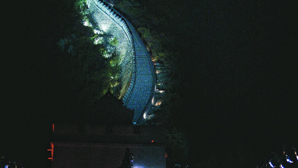Arguably one of today's most Teflon-coated industries, fashion continues its global advance at breakneck speed, seemingly immune to any geographic, nationalist, political, religious or moral barriers., Fashion show by Fendi being held on the Great Wall of China, at night.
