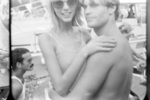 Designer Victor Hugo (left) and model Karen Bjornson in the arms of John McDonald.