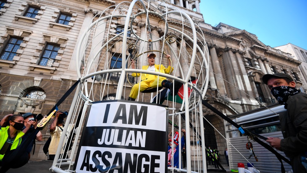 Julian Assange extradition case. Fashion designer and businesswoman Dame Vivienne Westwood is suspended in a ten foot high bird cage outside the Old Bailey in London to protest against the US extradition of Julian Assange. Picture date: Tuesday July 21, 2020. See PA story LEGAL Assange. Photo credit should read: Victoria Jones/PA Wire URN:54673147 (Press Association via AP Images)