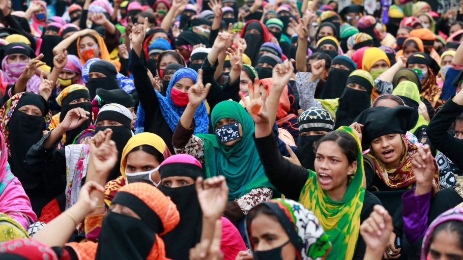 Bangladeshi garment workers block a road as they gather in a protest demanding their unpaid wages during nationwide lockdown to curb the spread of coronavirus in Dhaka, Bangladesh, May 20, 2020. Apparel workers took to the streets in protest- risking exposure to Covid-19 - demanding to know when they would receive their due wages. Photo by Kanti Das Suvra/Abaca/Sipa USA(Sipa via AP Images)