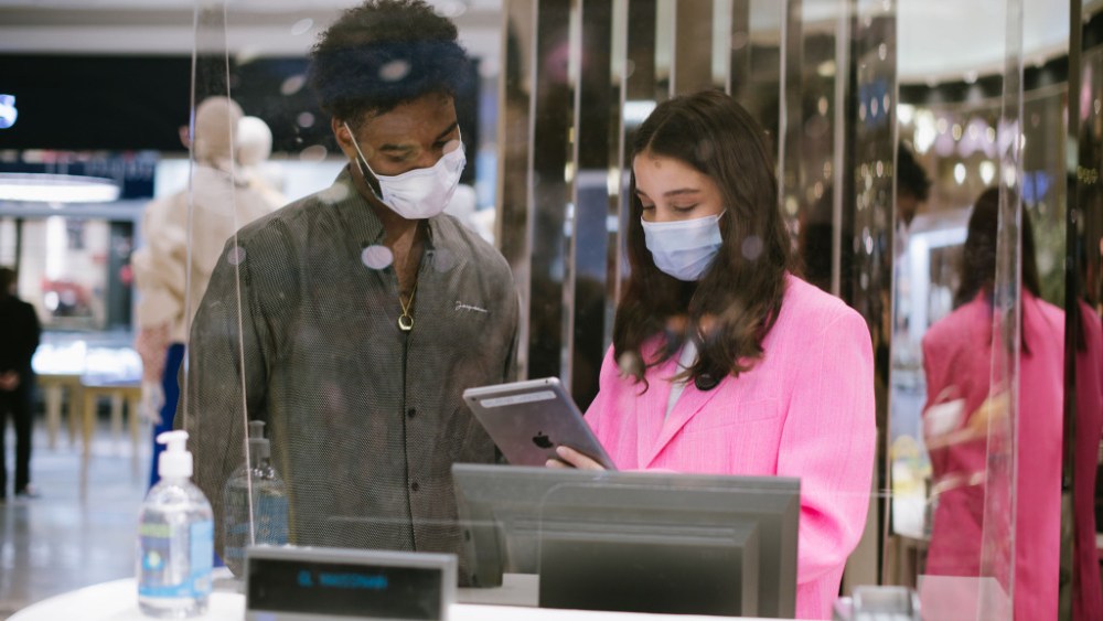 people with face masks in store