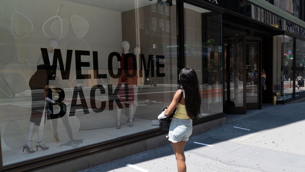 Retail stores start to serve customers indoors as New York City enters phase 2 of reopening. A woman doing window shopping at Zara women designer clothing store with huge Welcome Back sign on 1st day of reopening. Governor Andrew Cuomo has announced that New York City is on track for Phase 2 after data shows numbers of new infections and hospitalization is down.NYC restaurants, retail stores on Phase 2 reopen, New York, United States - 22 Jun 2020