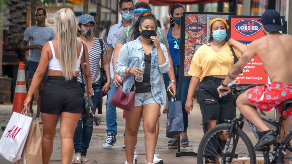 People walk through Lincoln Road section of Miami on July 12, as Florida has seen days of record breaking numbers of new coronavirus cases.