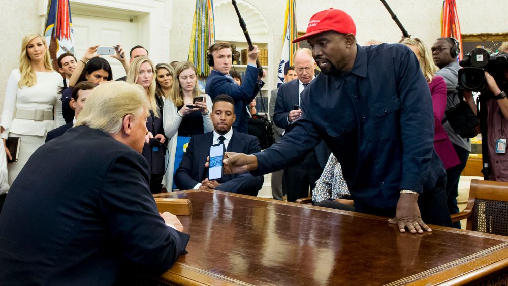 kanye west in oval office with president donald trump cameras (R) shows a cell phone depicting the image of an aircraft to US President Donald J. Trump (L) during their meeting in the Oval Office of the White House in Washington, DC, USA, 11 October 2018. West, who is a Trump supporter, met with the President to discuss prison reform and other issues.US President Donald J. Trump meets with US entertainer Kanye West and retired football player Jim Brown, Washington, USA - 11 Oct 2018