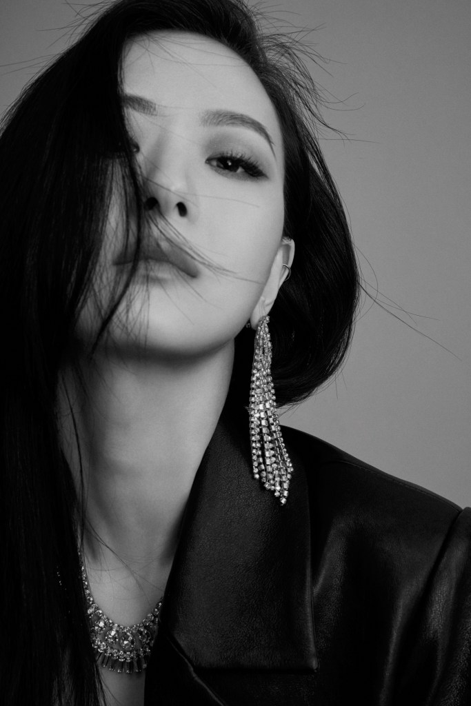 Sun wearing earrings and necklaces from the capsule.