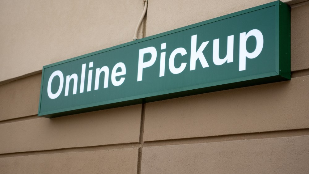 Sign noting a place to park to pick up food at grocery for socially distance during quartine for COVID-19 corona virus. St Paul Minnesota MN USA