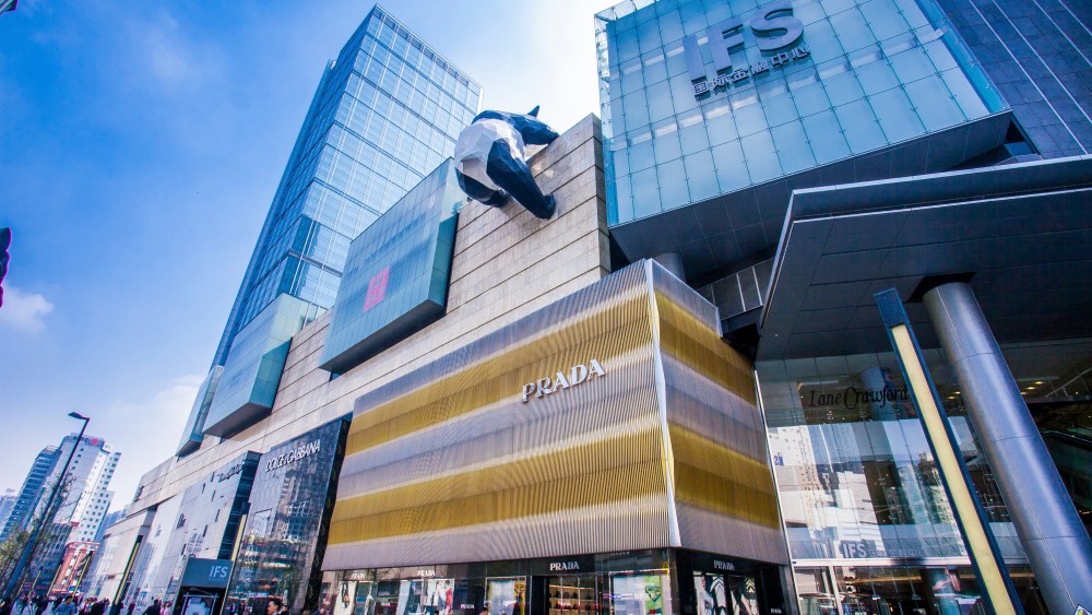People walk past the boutiques of Prada and other fashion brands at the Chengdu IFS.