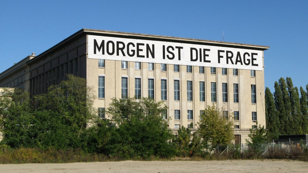A rendering of Berghain in Berlin plastered with a word-based artwork by Rirkrit Tiravanija.