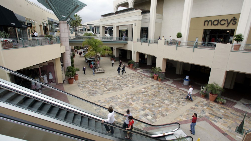 FILE - In this May 5, 2005 file photo, shoppers circulate through the Fashion Valley Mall, a Simon Property Group mall, in San Diego. The nation's largest shopping mall owner, Simon Property Group, on Tuesday, Feb. 16, 2010 made a $10 billion hostile bid to acquire its ailing rival, General Growth Properties. (AP Photo/Lenny Ignelzi, File)