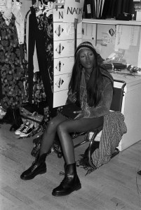 Naomi Campbell seated backstage at the Perry Ellis Spring 1993 show in New York, designed by Marc Jacobs.