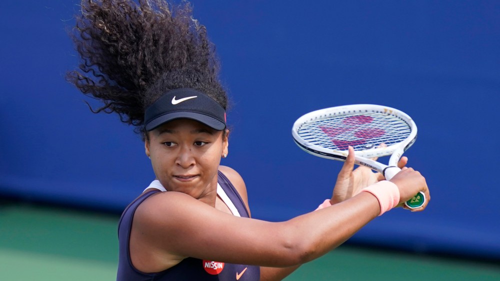 Naomi Osaka looks to return a shot to Anett Kontaveit, during the quarterfinals at the Western & Southern Open tennis tournament Wednesday, Aug. 26, 2020, in New York.