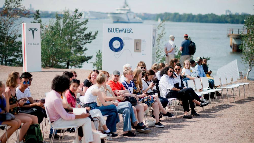 Showgoers attending the Vaude show during Helsinki Fashion Week in 2018.