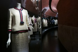 Caption: Chanel tweed suits are displayed in the new “Gabrielle Chanel Galleries” at Palais Galliera.