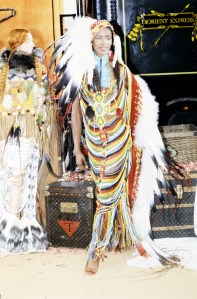 Model Naomi Campbell poses in and ensemble from the "Diorient Express" collection designed by John Galliano.