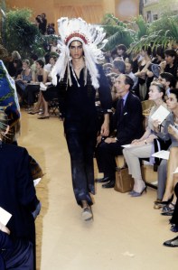 A model poses in ensemble from the "Diorient Express" collection designed by John Galliano.