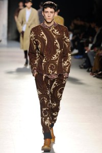 A model on the runway at Dries Van Noten's fall 2013 menswear show at Palais de Tokyo.