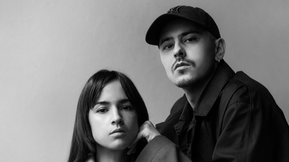Victoria Feldman and Tomas Berzins pose for a black and white portrait.