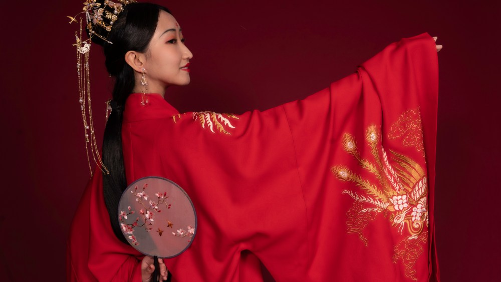 A member of New York Hanfu Corporation pose for a photoshoot.
