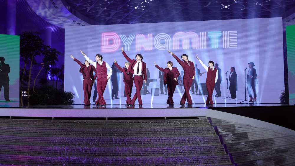 RM, V, Jimin, Jungkook, Jin, J-Hope, and Suga of BTS perform onstage.