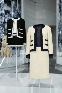 Gabrielle Chanel designed versions of her signature suit until her death in 1971. Here, one of her designs from 1963 and one from Karl Lagerfeld for Chanel in 1994.