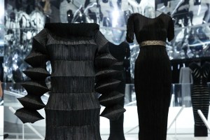 Issey Miyake’s “Flying Saucer” dress from 1994 and Mariano Fortuny y Madrazo’s “Delphos” dress from 1930.