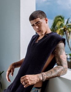 Maison Margiela's wool vest (available at The Webster Bal Harbour Shops) and Levi's cotton denim jeans.