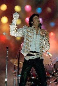 FILE - Singer Michael Jackson, performs during  "Victory Tour"  in this July 1984 file photo taken in the USA. Bidders from around the world bought up Michael Jackson memorabilia worth nearly $1 million at an auction on the anniversary of his death, Friday June 25, 2010 including $190,000 for the Swarovski-crystal-studded glove he wore on his 1984 Victory Tour. (AP Photo, File)