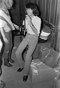 Designer Kenzo Takada backstage at his Spring RTW 1974 show.