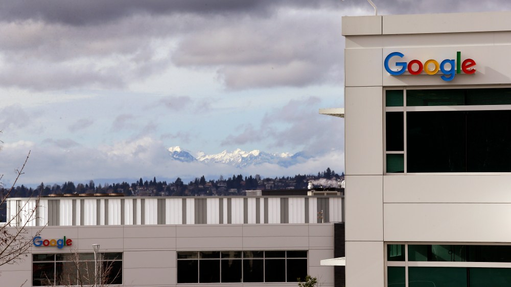 The Google campus is seen in view of the Olympic mountains breaking briefly through the clouds at the opening of the expansion of the campus Tuesday, Feb. 16, 2016, in Kirkland, Wash. The expansion doubles the size of the campus and makes Google's Puget Sound Operations the third-largest engineering center for the company in the country. The campus is home to engineering teams working on Google products that include Hangouts, Cloud, Chrome and Ads. (AP Photo/Elaine Thompson)