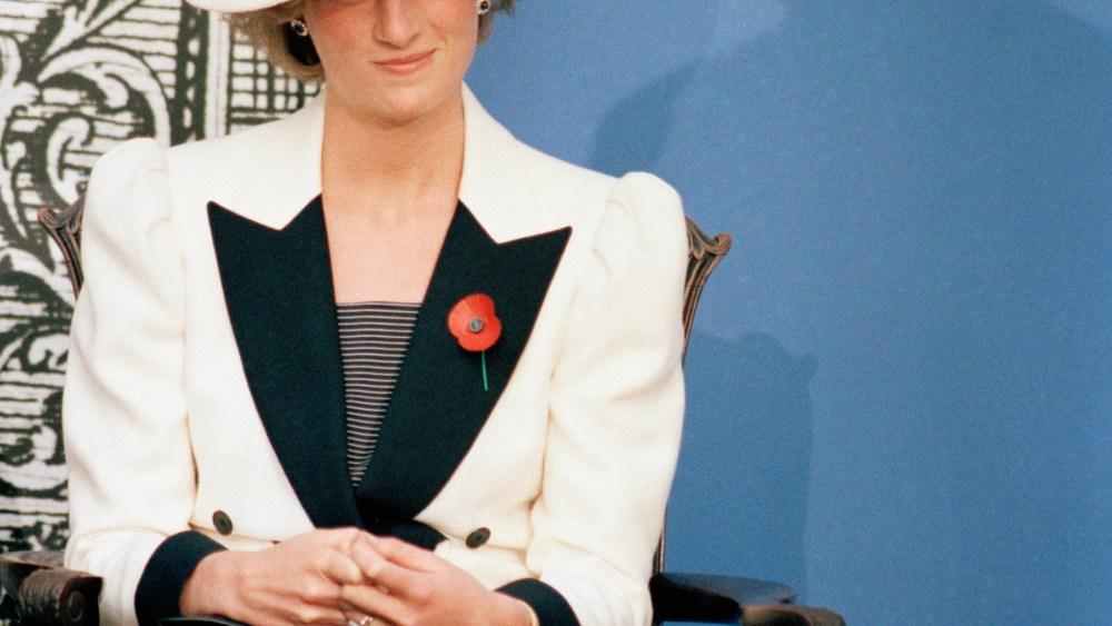 Princes Diana of Wales casts a glance at Prince Charles as he speaks at a press conference at the National Gallery of Art, in Washington, 1985.