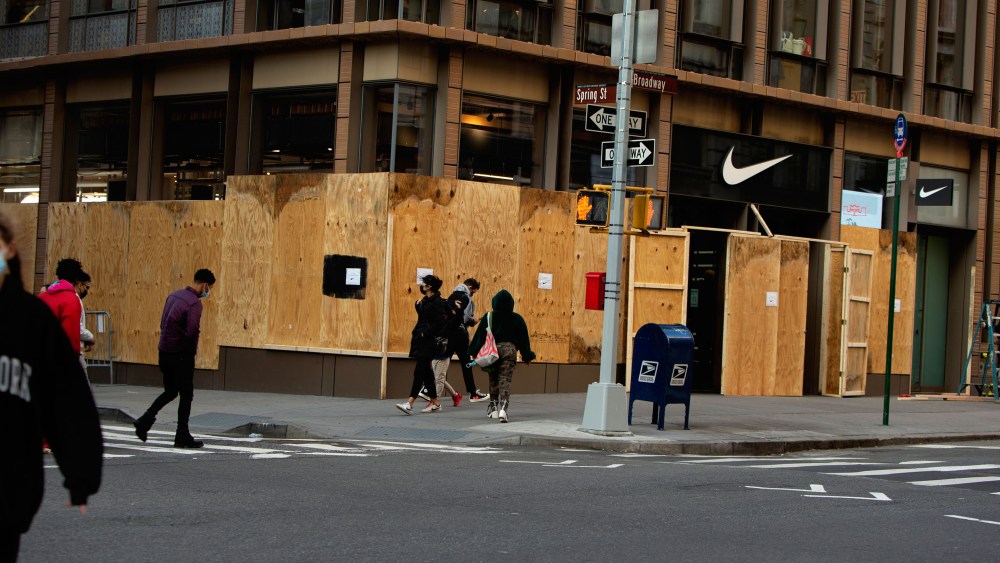 Boarded up stores across SoHo in New York .