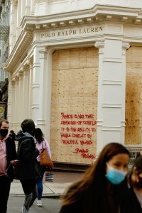 Boarded up stores across SoHo in New York .