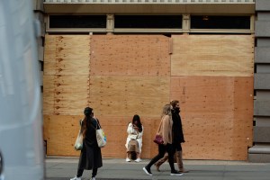 Boarded up stores across SoHo in New York .