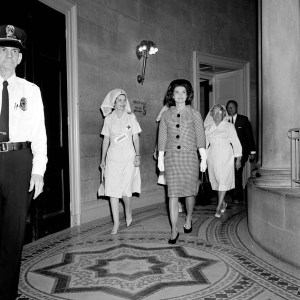 Jackie Kennedy and Red Cross Nurses arrive for a luncheon at the White House.