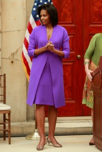 First Lady Michelle Obamas attends the reopening of the entrance to the Metropolitan Museum of Art’s American Wing, in New York City. Obama wears a sheath and coat from pre-fall 2009 Isaac Mizrahi.