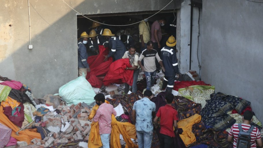 Rescuers look for survivors at the site of fire at a factory in an industrial area on the outskirts of Ahmedabad, India, Wednesday, Nov. 4, 2020.