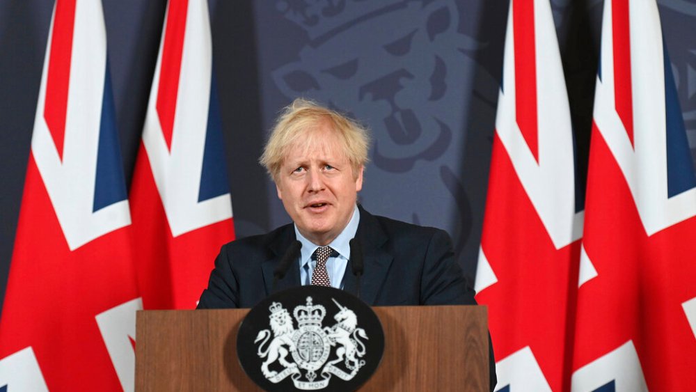 Britain's Prime Minister Boris Johnson speaks during a media briefing in Downing Street, London, Thursday, Dec. 24, 2020. Britain and the European Union have struck a provisional free-trade agreement that should avert New Year's chaos for cross-border commerce and bring a measure of certainty to businesses after years of Brexit turmoil. The breakthrough on Thursday came after months of tense and often testy negotiations that whittled differences down to three key issues: fair-competition rules, mechanisms for resolving future disputes and fishing rights. (Paul Grover/Pool Photo via AP)