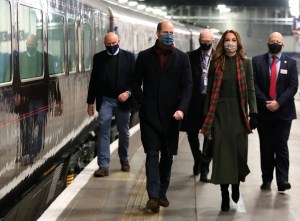 Duke and Duchess of Cambridge royal train tour. The Duke and Duchess of Cambridge board the royal train at London Euston Station as they leave London for a tour across the UK. Picture date: Sunday December 6, 2020. During the tour William and Kate will visit communities, outstanding individuals and key workers to thank them for their efforts during the coronavirus pandemic. See PA story ROYAL Train. Photo credit should read: Chris Jackson/PA Wire URN:56981255 (Press Association via AP Images)