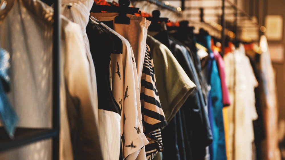 Clothes on racks in a fashion boutique