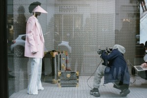 Olivier Rousteing shooting Balmain Pre-Fall 2021 collection in the windows of its Rue Saint-Honoré boutique.