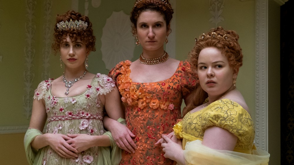 BRIDGERTON (L to R) HARRIET CAINS as PHILLIPA FEATHERINGTON, BESSIE CARTER as PRUDENCE FEATHERINGTON and NICOLA COUGHLAN as PENELOPE FEATHERINGTON in episode 10 of BRIDGERTON Cr. LIAM DANIEL/NETFLIX © 2020