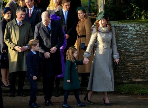 Britain's Prince William, Duke of Cambridge and Catherine, Duchess of Cambridge stand with their children Prince George and Princess Charlotte outside the St Mary Magdalene Church in Sandringham in Norfolk, England, Wednesday, Dec. 25, 2019. (AP Photo/Jon Super)
